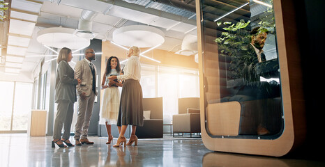 Lobby, talking and business people in office for coworking space for collaboration, teamwork and...