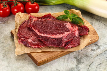 Raw beef cheeks cut for cooking