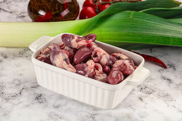 Raw chicken hearts in the bowl