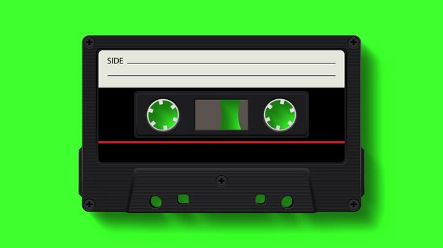 Retro analog audio cassette black spinning and playing music on green background