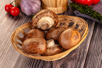 Raw brown champignon heap for cooking