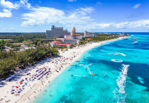 Aerial view of the public beach at Goodmans Bay, Nassau, Bahamas, with water sports action and turquoise ocean