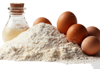 A heap of integral barley flour accompanied by a wooden spoon and eggs is set against a white background with a clipping path