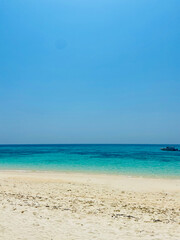 Tranquil tropical beach with white sand and clear water