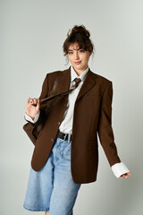 Chic young woman confidently displays modern fashion trends in an urban setting