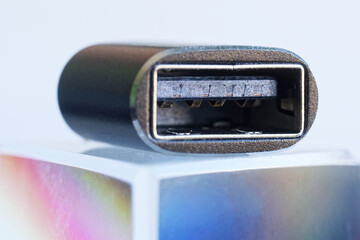 A macro view of a modern OTG adapter showcasing a USB Type-A female port, perfect for illustrating...