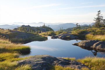 Obraz premium High-altitude lake amidst rocky terrain in serene landscape