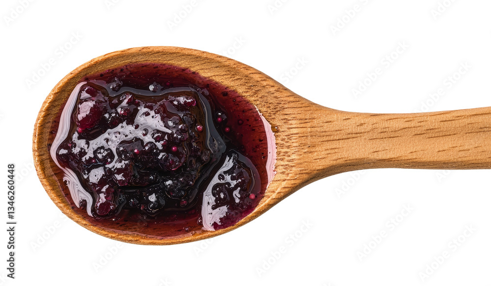 Poster elderberries that have been squeezed yield juice and syrup, which are held in a wooden spoon surroun