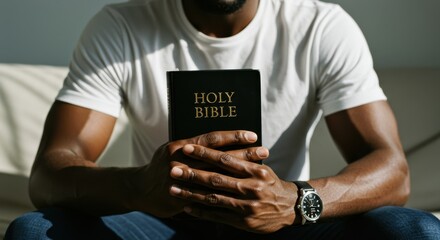 Strong Faith: Athletic Black Man Holding the Holy Bible