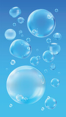 Floating blue bubbles on a white background. Various sizes of blue bubbles create a light, airy feel. Blue bubbles add a whimsical touch to the design. Soap bubble element vector set.