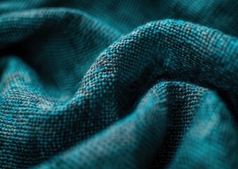Fototapeta premium Close-up of textured teal fabric draped elegantly.