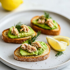 Healthy Snack: Mini Toasts with Tuna Fish, Avocado and Lemon