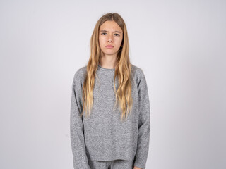 Offended dissatisfied beautiful caucasian girl wearing grey track-suit  with moody displeased...