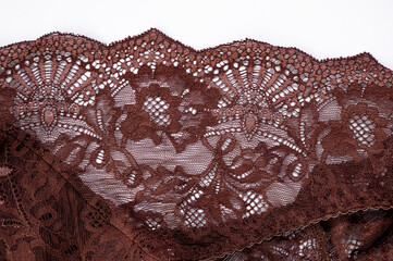 brown lace, isolated on white background. brown lace fabric, texture, background, pattern.