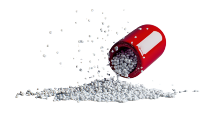 Red pill releasing white granules on transparent background