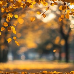 Obraz premium Golden autumn leaves with soft bokeh background.