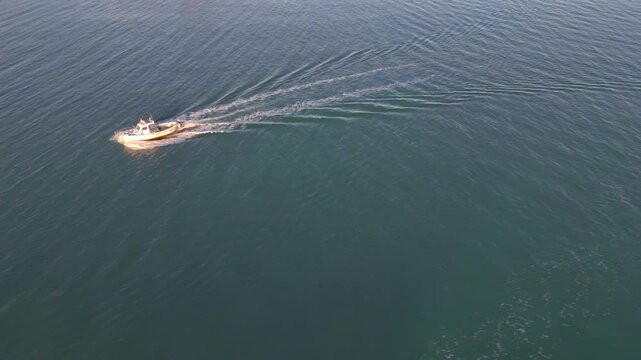Aerial View of a Small Boat Cruising Through Calm Adriatic Waters