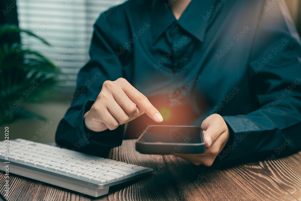 Poster business person using smartphone while working at desk with computer keyboard and soft light, busine