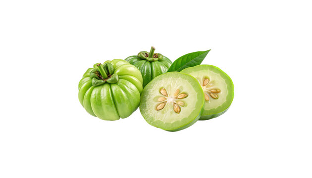 Close up of green garcinia cambogia fruits with leaf and sliced halves on a black background
