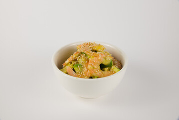 Fresh Japanese Spicy Seafood Poke Bowl with Avocado and Sesame Seeds