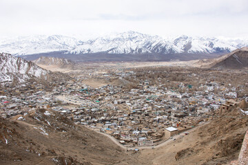 View landscape and cityscape of Leh Ladakh Village with high mountain range from viewpoint Tsemo Maitreya Temple or Namgyal Tsemo Monastery while winter season in Jammu and Kashmir, India