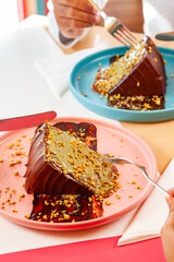 Dubai chocolate cake Knafeh dessert served on a plateat a cafe restaurant.