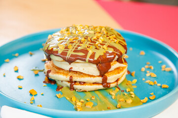 Dubai chocolate kunafa pancakes served at a fancy restaurant cafe.