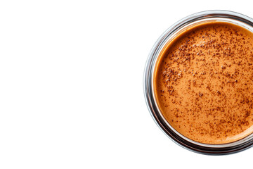 Rich coffee topped with cocoa powder in a clear glass jar