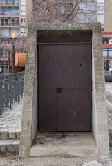 Girona, Spain - Feb 23, 2025: Air raid shelter in Girona. Streets, buildings. Lifestyle in the urban area. Cloudy winter day. Selective focus