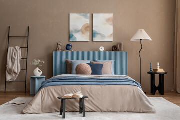 Minimalist bedroom decor with abstract artwork, a soft-toned bed, and sculptural bedside...