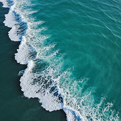 Fototapeta premium Aerial view beautiful of sea waves from drone. Stock image of blue color of ocean water, sea surface. Top view on turquoise waves, clear water surface texture.