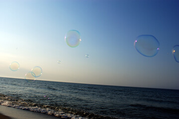 soap bubbles in the wind on the seashore