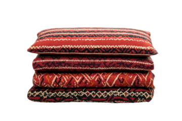 Decorative cushions with intricate patterns stacked together