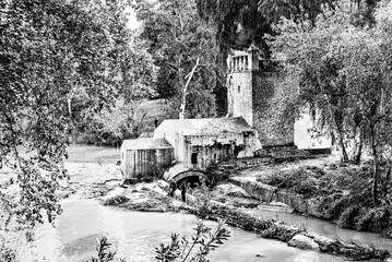 Carob mill along the banks of the Guadaira River, within Oromana Park in Alcalá de Guadaira,...