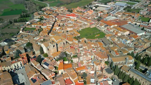 Peralada aerial view revealing historic peralada, medieval catalan town nestled amid verdant landscape, displaying traditional architecture and scenic urban layout in northeastern spain