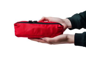 Female hand holding red first aid medical kit bag isolated on white background PNG. AI GENERATIVE