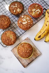 Homemade Banana muffins topped with nuts, selective focus