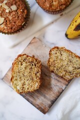 Homemade Banana muffins topped with nuts, selective focus