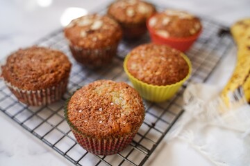 Homemade Banana muffins topped with nuts, selective focus