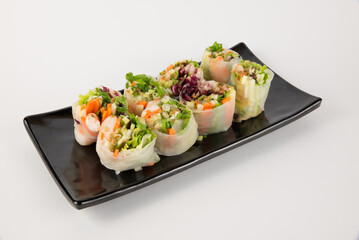 Fresh Vietnamese Spring Rolls with Shrimp and Vegetables on Black Plate