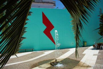 Water fountain and lightning bolt on the wall