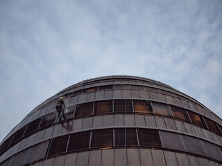 Man cleaning building