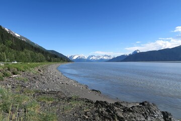 Snow-covered mountains in the distance seen from the Seward highway, Anchorage, Alaska