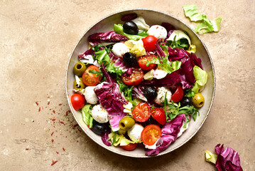 Vegetable salad with mozzarella. Top view with copy space.