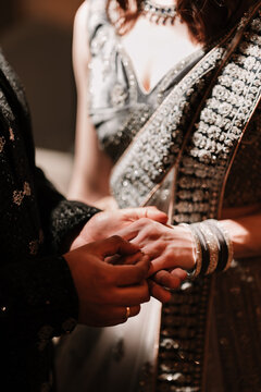 Close-ups details or poses of engaged couple's hands with ring