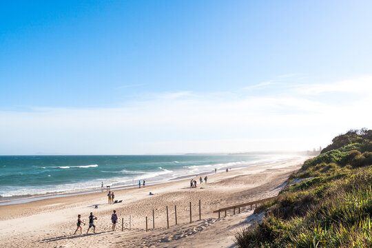 A variety of people and families enjoy a summers day holiday at long beach