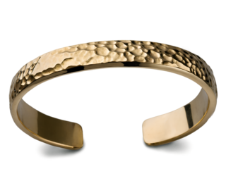Elegant hammered gold cuff bracelet showcasing unique texture and design