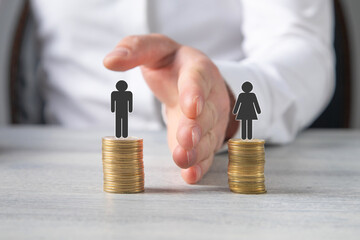 Coins with a Gender pay gap inequality concept.