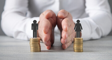 Coins with a Gender pay gap inequality concept.