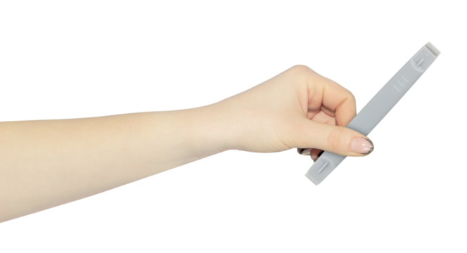 plastic spatula for disassembling the case of phones and laptops in hand, outstretched hand with plastic spatula isolated from background